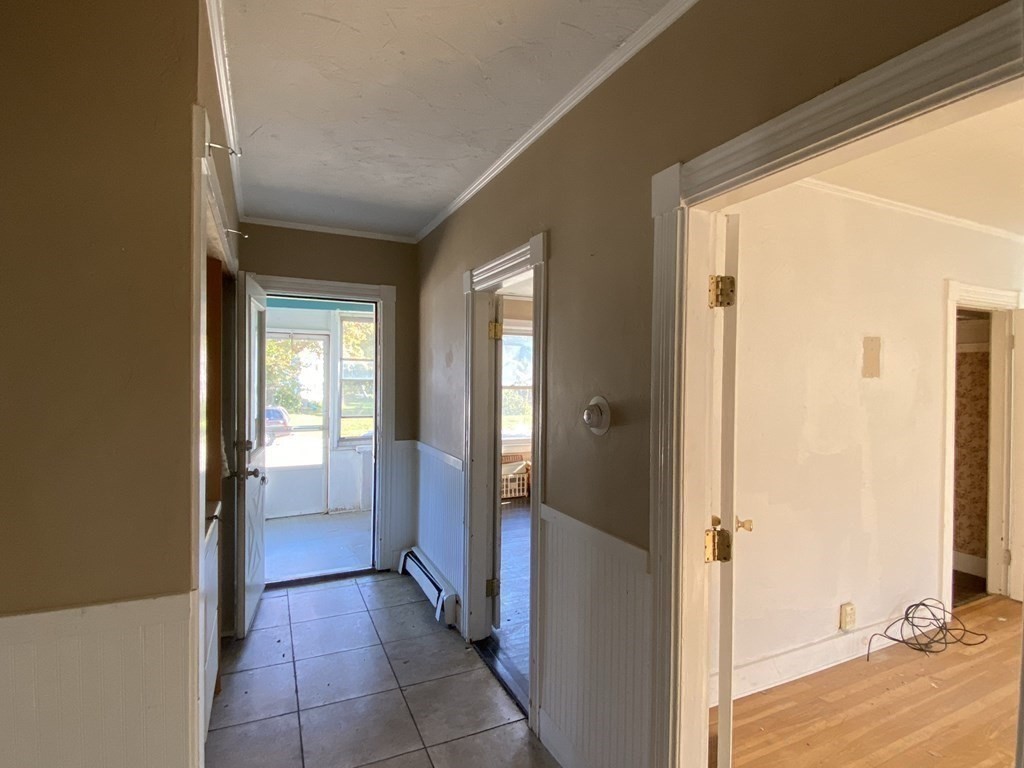 10 Thompson Road Webster, MA 01570 - Photo 10 of 37 a view of a hallway with bathroom and wooden floor
