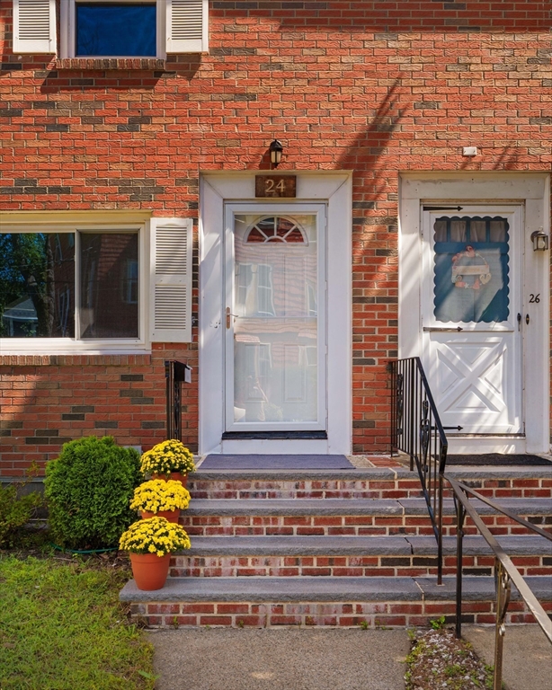 24 Goldsmith Street, Unit 24 Boston, MA 02130 - Photo 18 of 23 a front view of a house with a garden