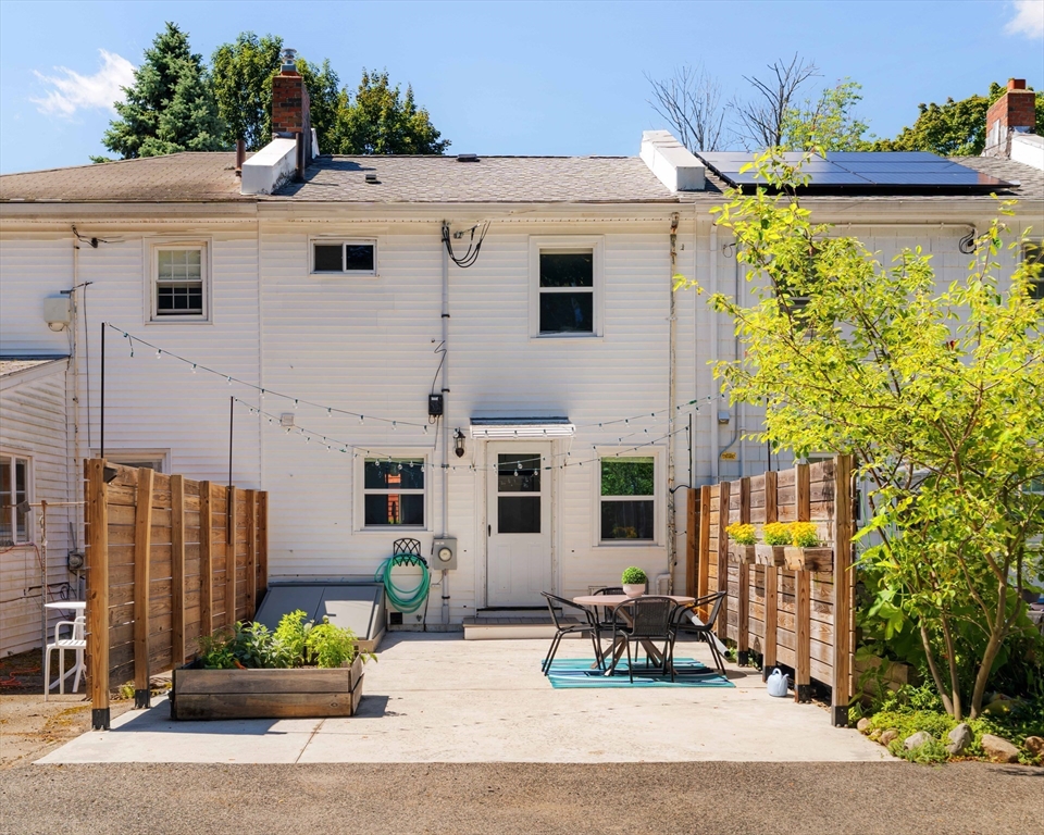 24 Goldsmith Street, Unit 24 Boston, MA 02130 - Photo 20 of 23 a front view of a house with a yard