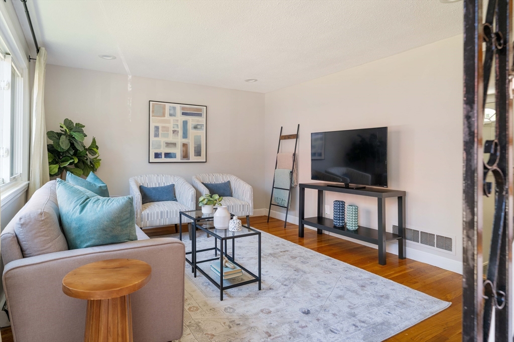 24 Goldsmith Street, Unit 24 Boston, MA 02130 - Photo 4 of 23 a living room with furniture and a flat screen tv