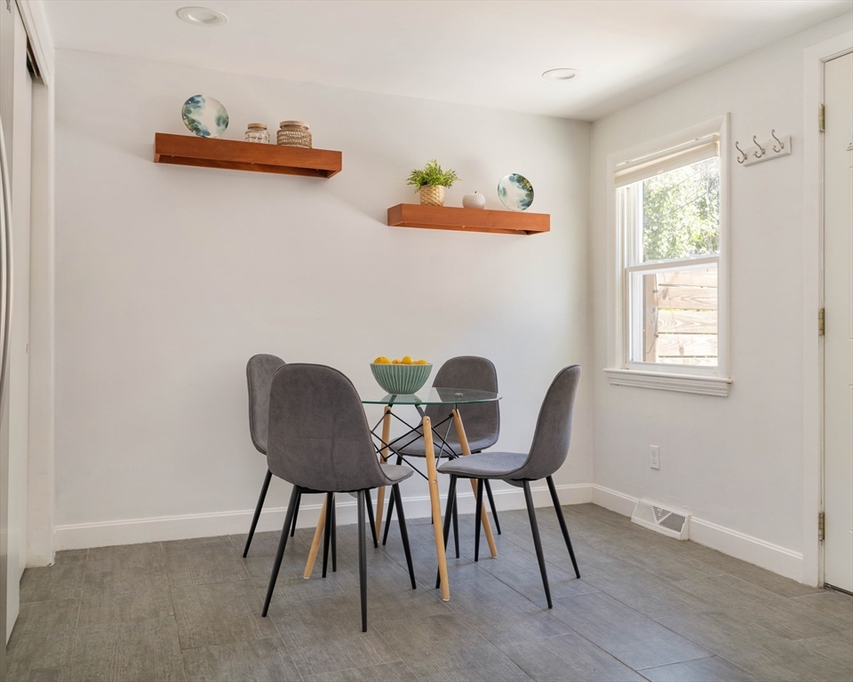 24 Goldsmith Street, Unit 24 Boston, MA 02130 - Photo 9 of 23 a view of a workspace with furniture and a window
