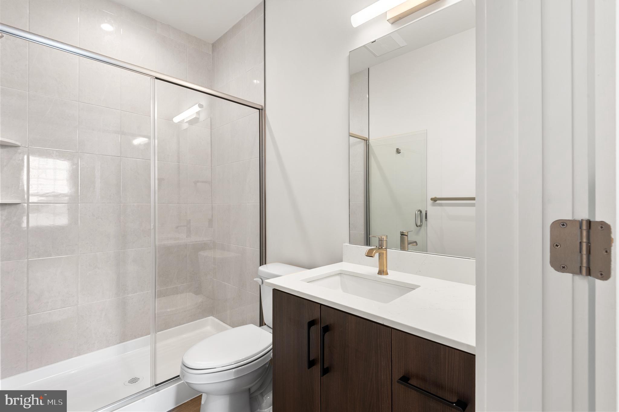 26 South York Road, Unit 301 Hatboro, PA 19040 - Photo 11 of 52 a bathroom with a sink a toilet and shower