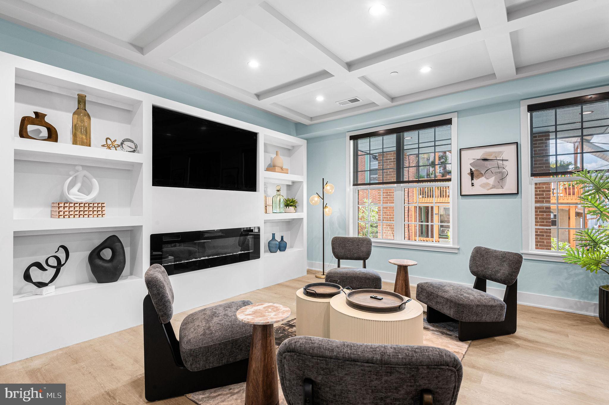 26 South York Road, Unit 301 Hatboro, PA 19040 - Photo 21 of 52 a living room with furniture a flat screen tv and a large window