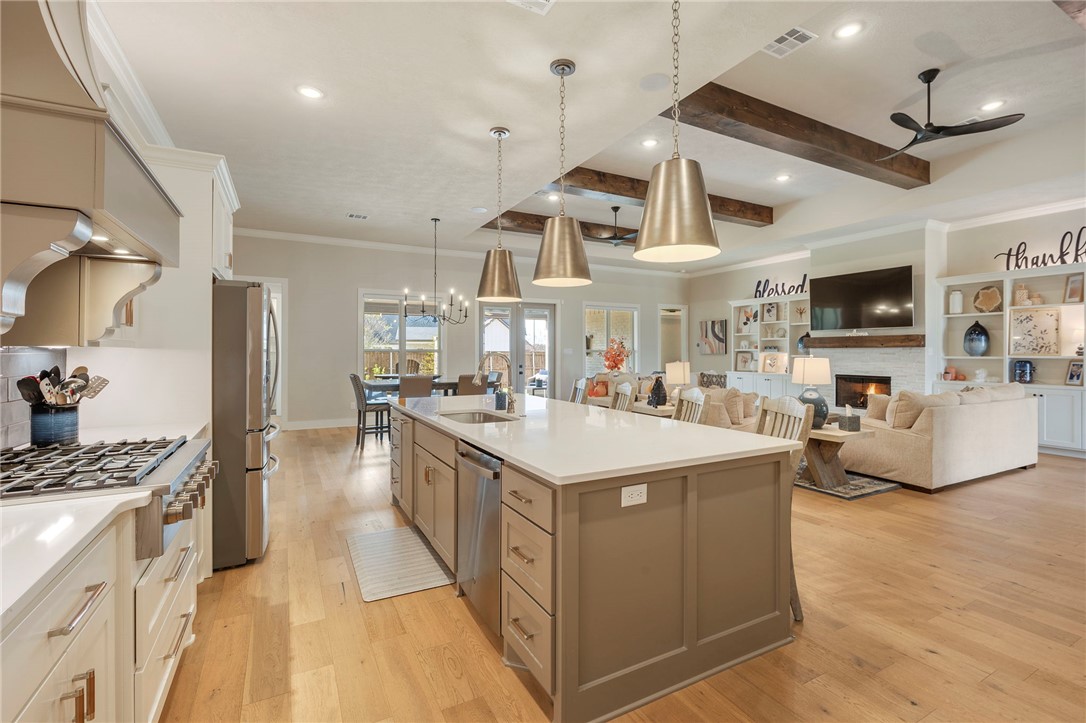4804 Crystal Ridge Court College Station, TX 77845 - Photo 17 of 48 a kitchen with stainless steel appliances kitchen island granite countertop a sink and a stove