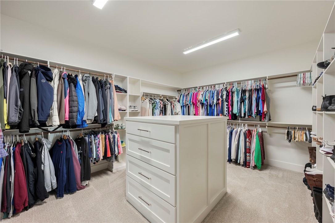 4804 Crystal Ridge Court College Station, TX 77845 - Photo 24 of 48 a view of walk in closet with clothes and shoes