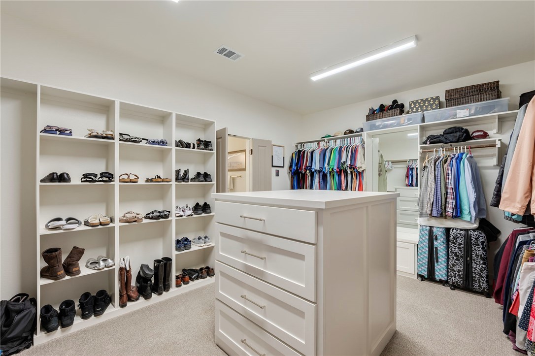 4804 Crystal Ridge Court College Station, TX 77845 - Photo 25 of 48 a view of walk in closet with clothes and shoes