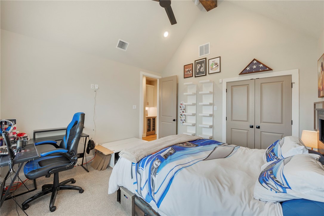 4804 Crystal Ridge Court College Station, TX 77845 - Photo 27 of 48 a bedroom with a bed a desk and chair