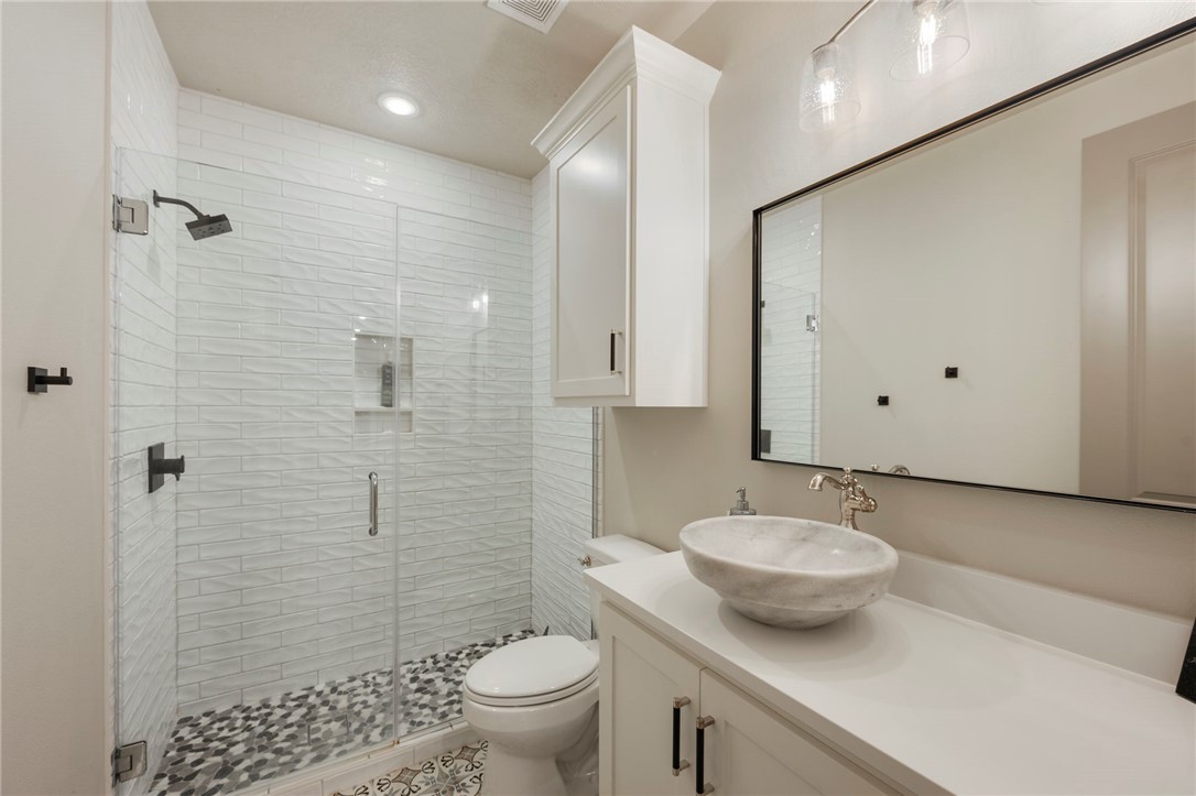 4804 Crystal Ridge Court College Station, TX 77845 - Photo 28 of 48 a bathroom with a sink toilet and shower