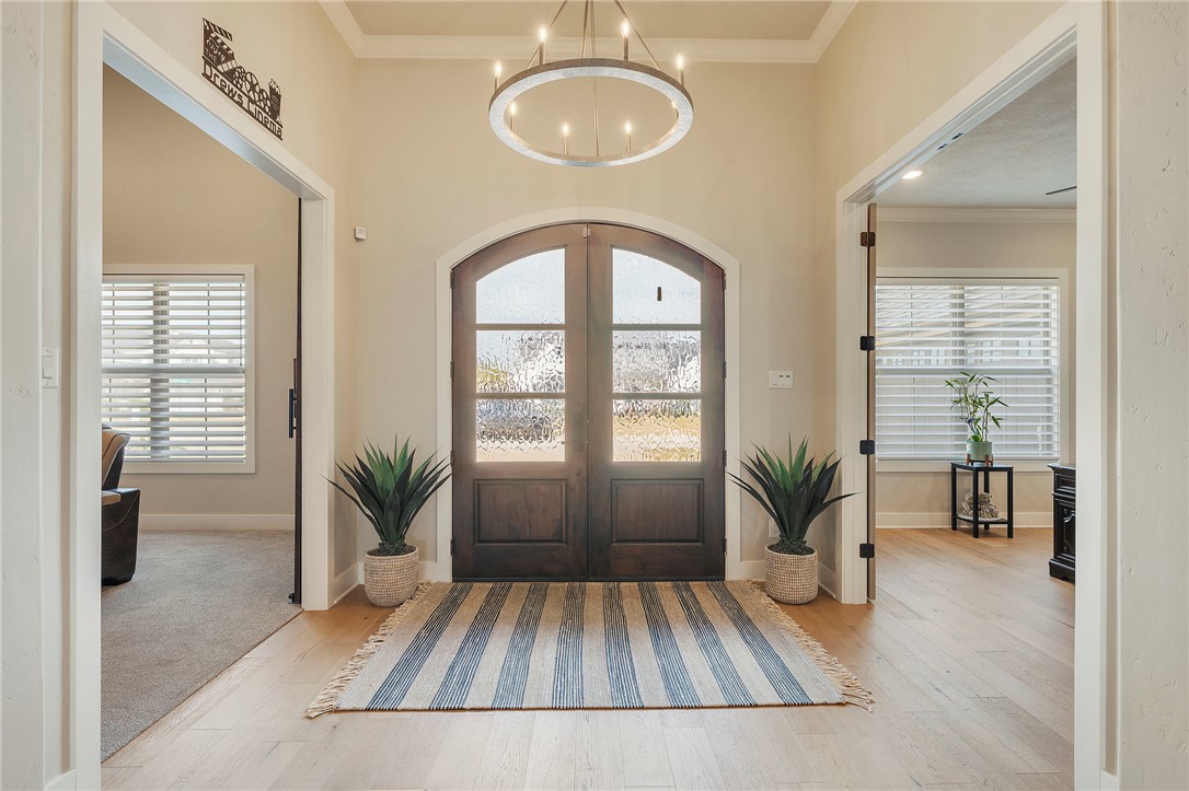 4804 Crystal Ridge Court College Station, TX 77845 - Photo 4 of 48 a view of an entryway with wooden floor and a potted plant