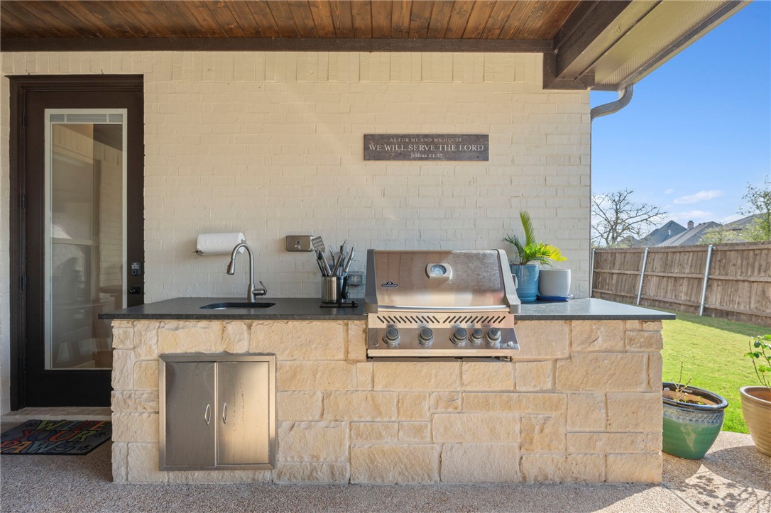 4804 Crystal Ridge Court College Station, TX 77845 - Photo 41 of 48 a kitchen with a sink and a stove top oven
