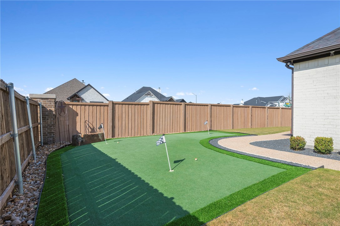 4804 Crystal Ridge Court College Station, TX 77845 - Photo 42 of 48 a view of a wooden house with a small yard and a wooden fence