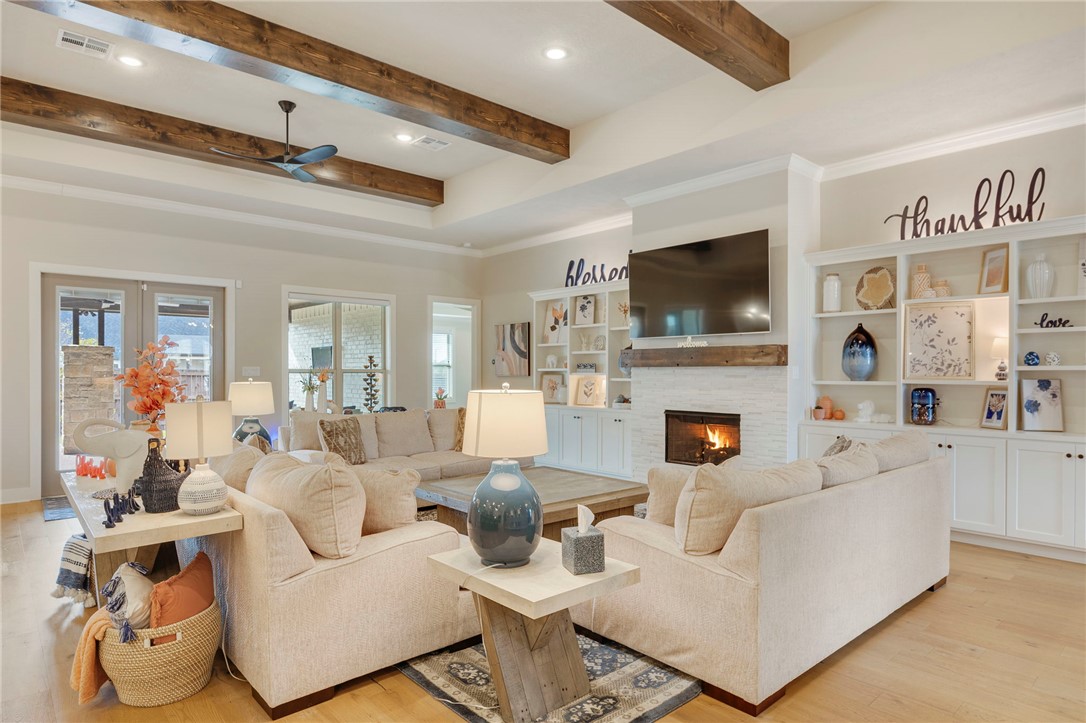 4804 Crystal Ridge Court College Station, TX 77845 - Photo 8 of 48 a living room with fireplace furniture and a flat screen tv