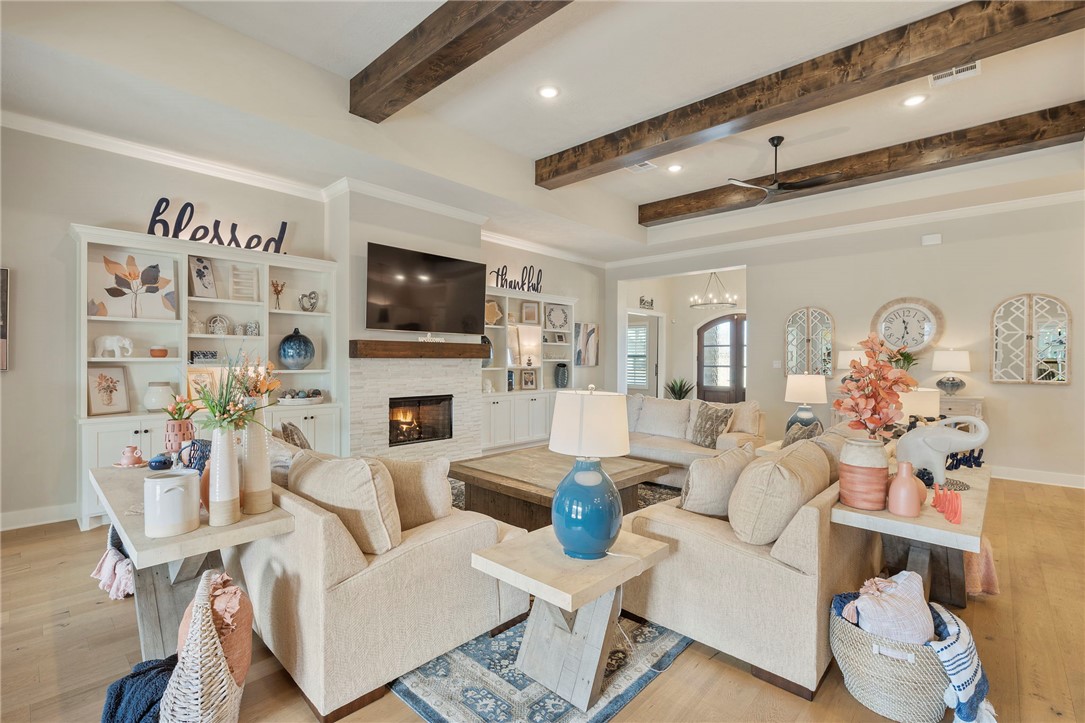 4804 Crystal Ridge Court College Station, TX 77845 - Photo 10 of 48 a living room with fireplace furniture and a flat screen tv