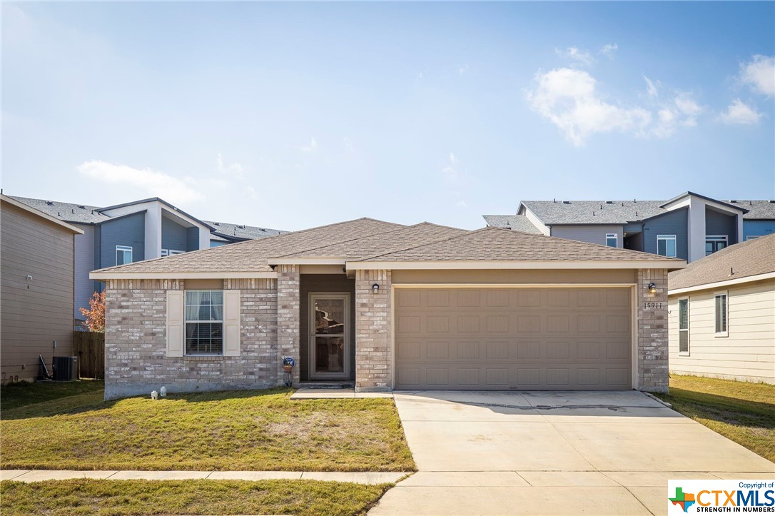 a view of a house with a swimming pool and a yard