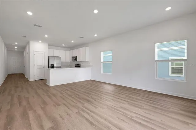 a view of kitchen with wooden floor