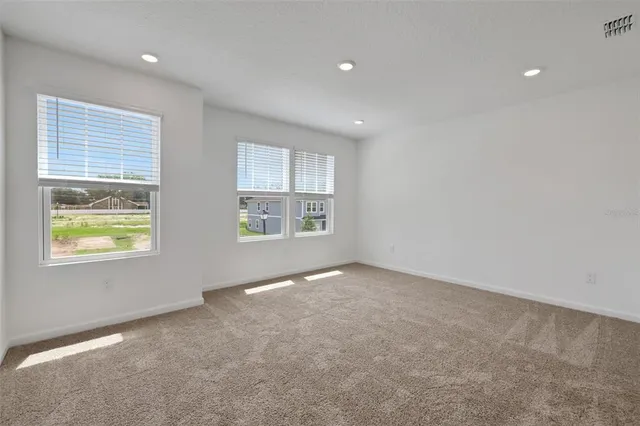 an empty room with windows