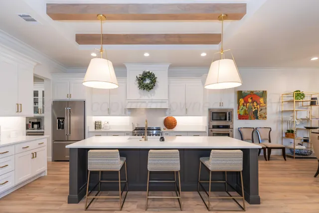 a kitchen with a stove a sink and a refrigerator