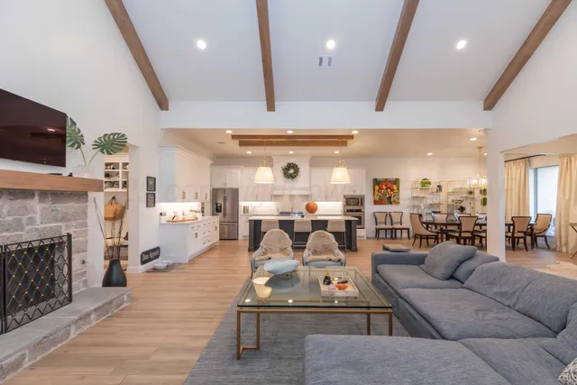 a view of a a dining room with furniture window and wooden floor