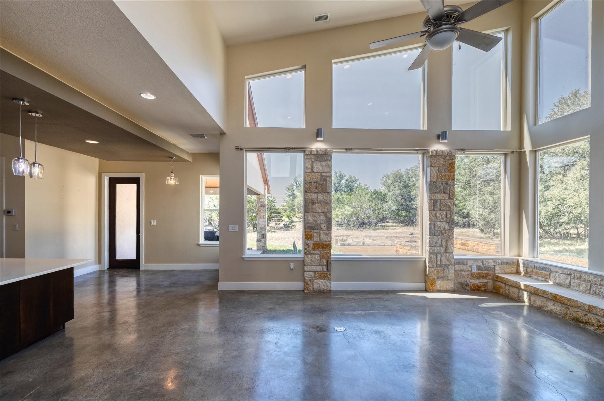 51 Starry Night Concan, TX 78838 - Photo 5 of 8 a view of an entryway with wooden floor and windows