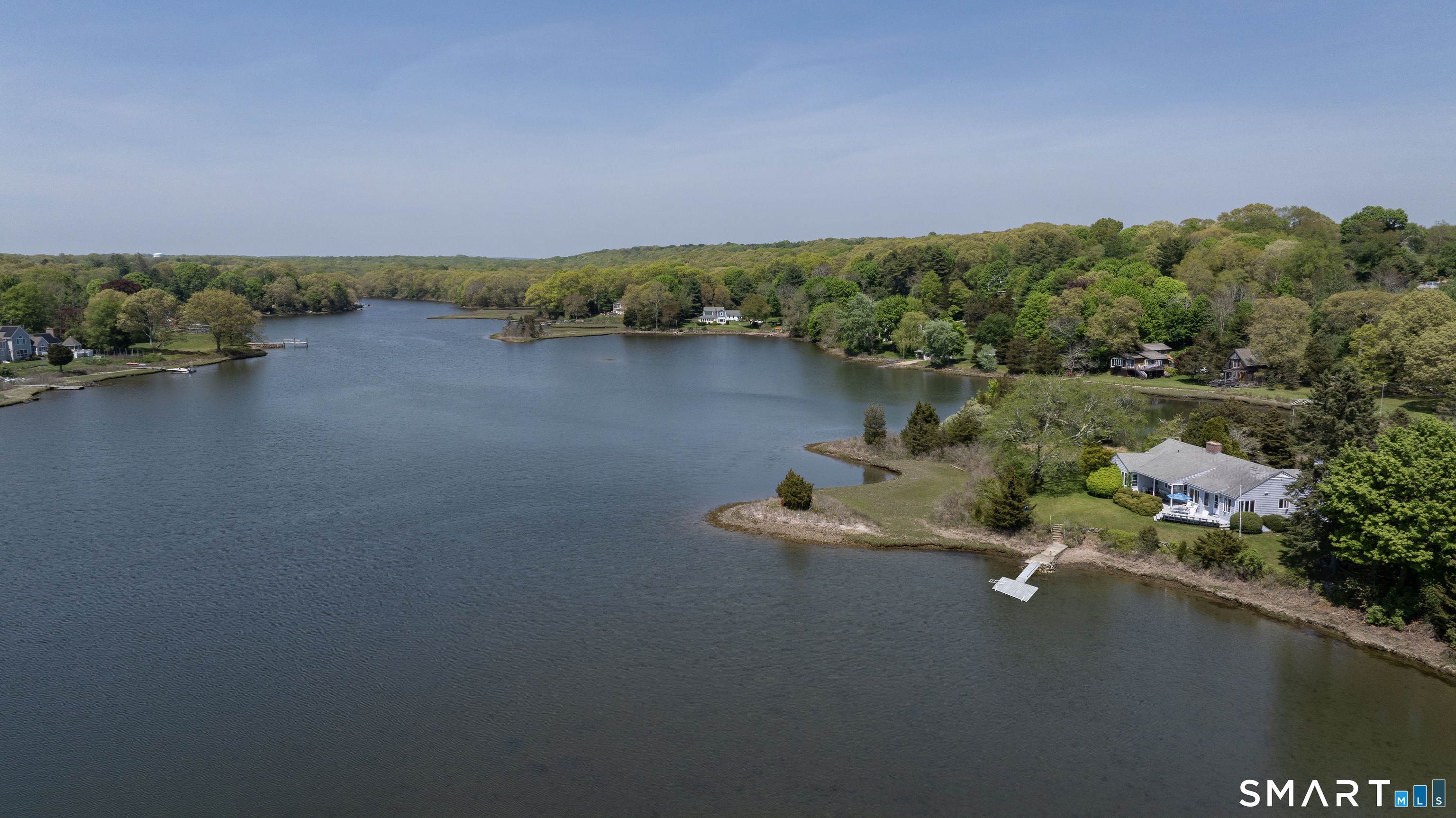27 Wilbur Road Stonington, CT 06378 - Photo 2 of 40 an aerial view of a house with a yard and lake view