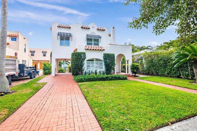 a front view of a house with yard