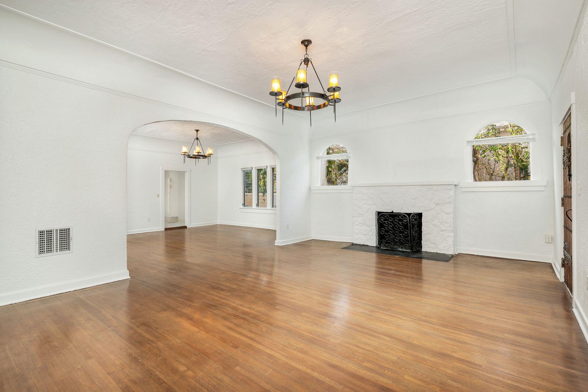 232 Rugby Road West Palm Beach, FL 33405 - Photo 7 of 40 a view of an empty room with a window and wooden floor