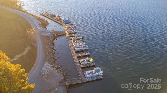 an aerial view of a house with a lake view
