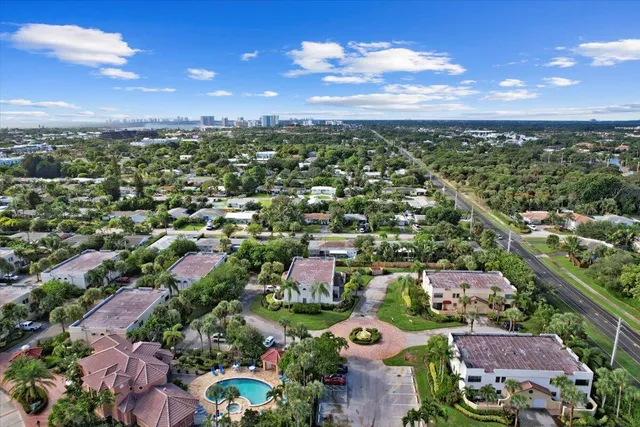 an aerial view of residential houses with city view