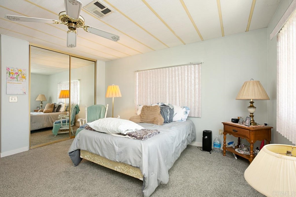2250 North Broadway, Unit 10 Escondido, CA 92026 - Photo 14 of 30 The master bedroom has a large closet with mirrored doors.