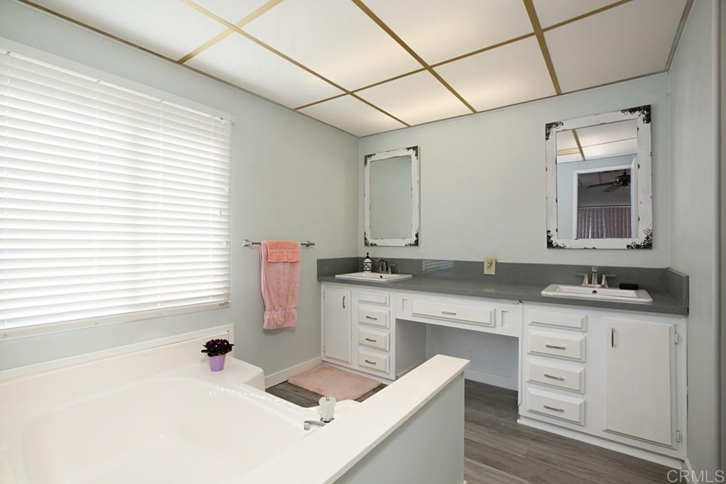 2250 North Broadway, Unit 10 Escondido, CA 92026 - Photo 15 of 30 The master bath boasts new quartz counters, dual sinks, and designer fixtures & mirrors.