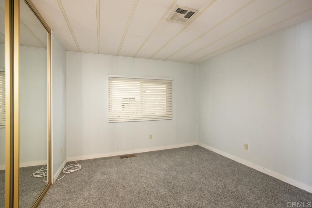 2250 North Broadway, Unit 10 Escondido, CA 92026 - Photo 18 of 30 The 2nd bedroom has new carpeting, mirrored closets, and closet organizers.