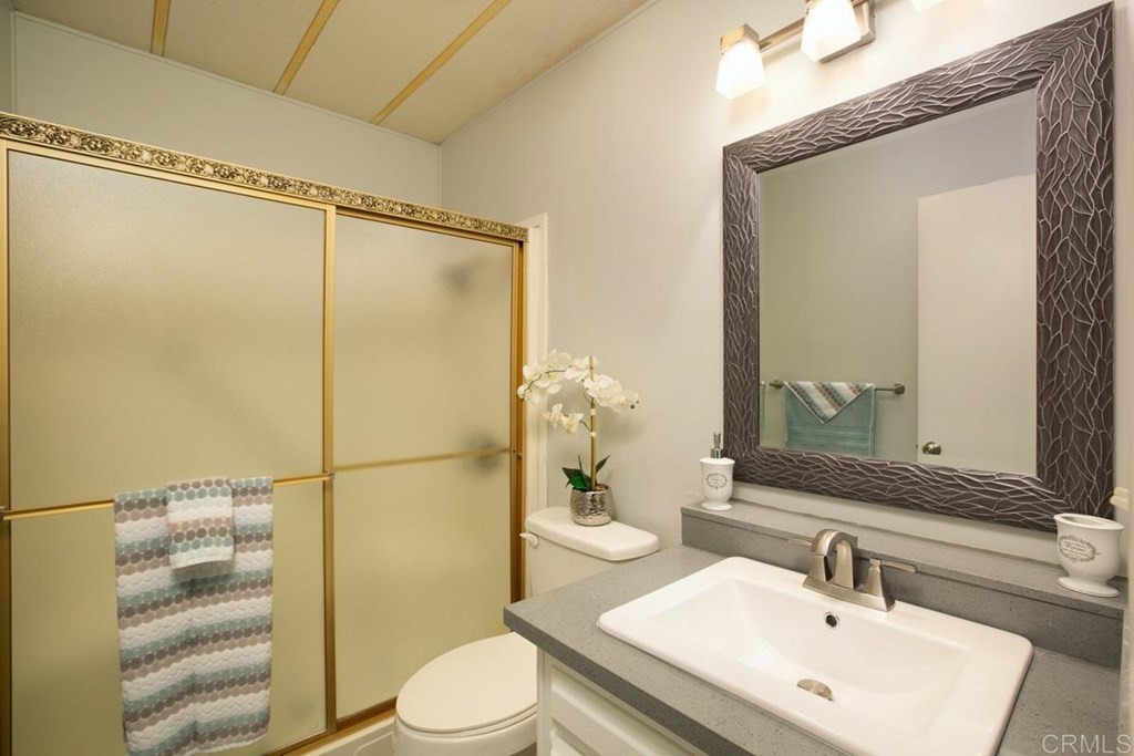 2250 North Broadway, Unit 10 Escondido, CA 92026 - Photo 19 of 30 The guest bath has a large shower and upgraded amenities.