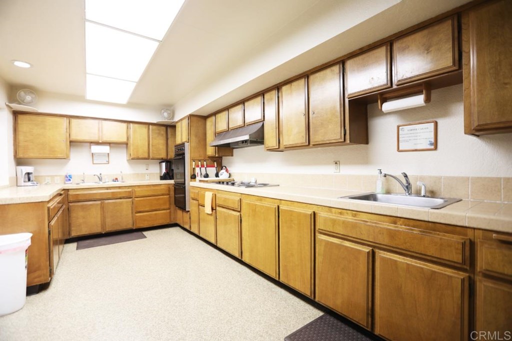 2250 North Broadway, Unit 10 Escondido, CA 92026 - Photo 29 of 30 This is the large kitchen in the clubhouse used for events.