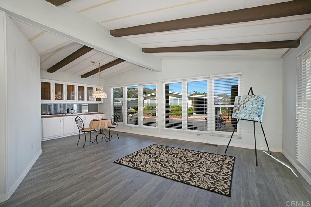 2250 North Broadway, Unit 10 Escondido, CA 92026 - Photo 5 of 30 The open living and dining room have vaulted ceilings. You'll love the new wood-look vinyl floors!
