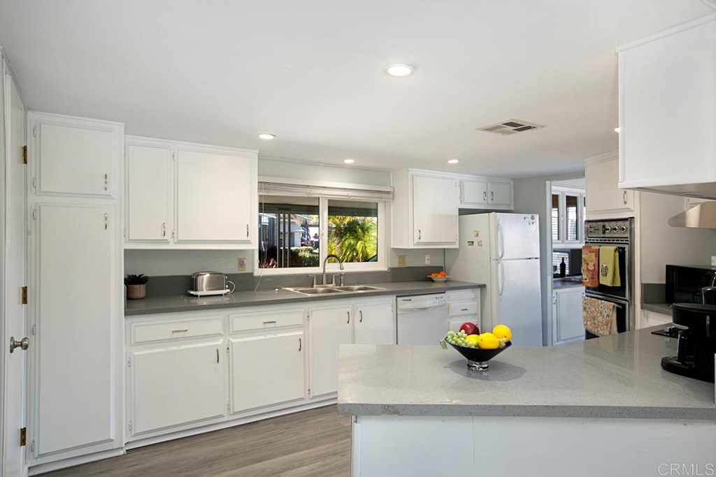 2250 North Broadway, Unit 10 Escondido, CA 92026 - Photo 8 of 30 The kitchen has new quartz counters and a new electric cooktop and hood!