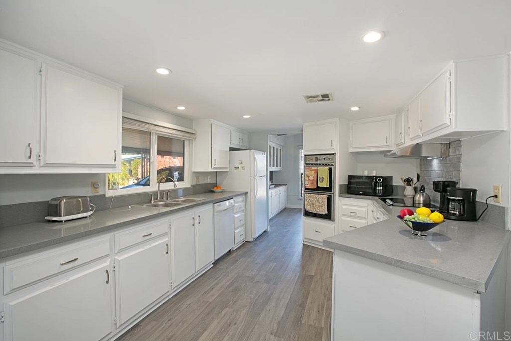 2250 North Broadway, Unit 10 Escondido, CA 92026 - Photo 9 of 30 The kitchen has a double oven and dual stainless sinks.