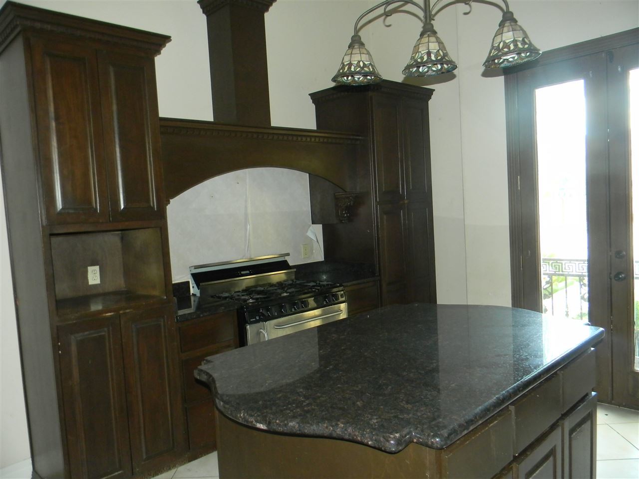 205 Lake Como Road Laredo, TX 78041 - Photo 11 of 20 a bathroom with a granite countertop sink a mirror and vanity