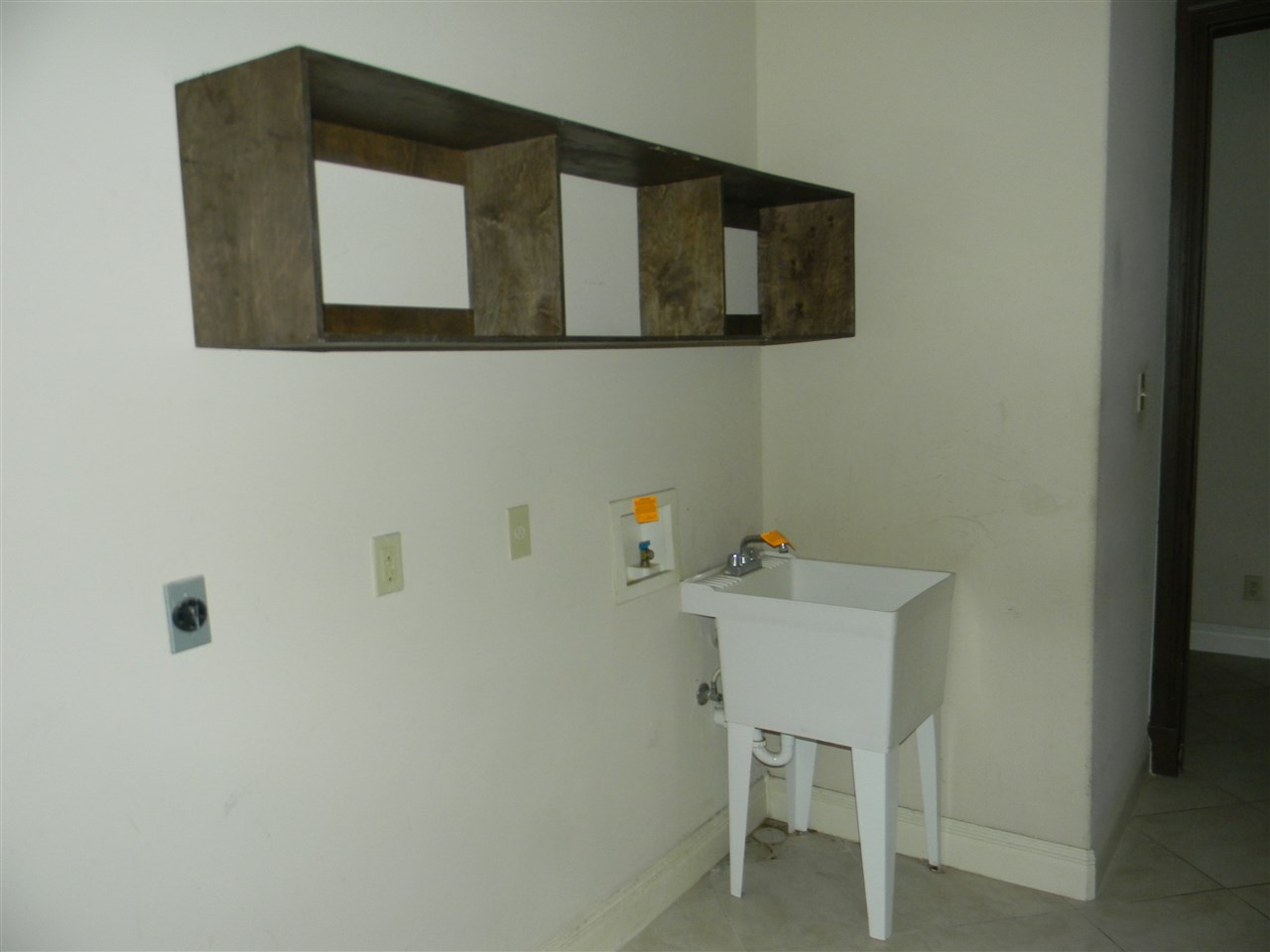 205 Lake Como Road Laredo, TX 78041 - Photo 16 of 20 a bathroom with a sink and a mirror