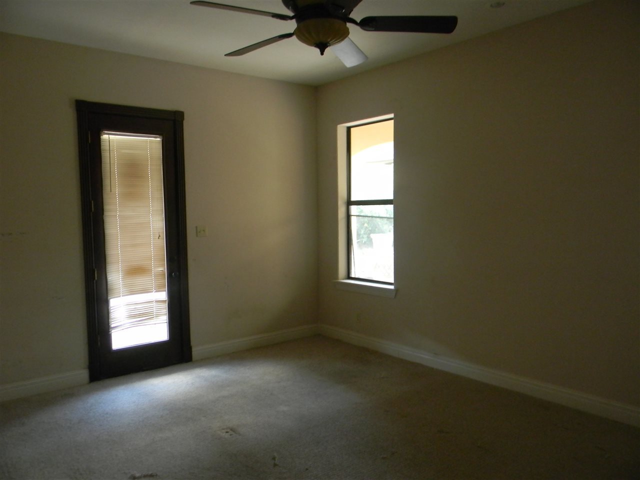 205 Lake Como Road Laredo, TX 78041 - Photo 18 of 20 an empty room with windows and fan