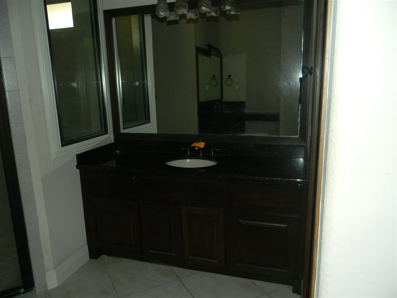205 Lake Como Road Laredo, TX 78041 - Photo 20 of 20 a bathroom with a sink and a mirror