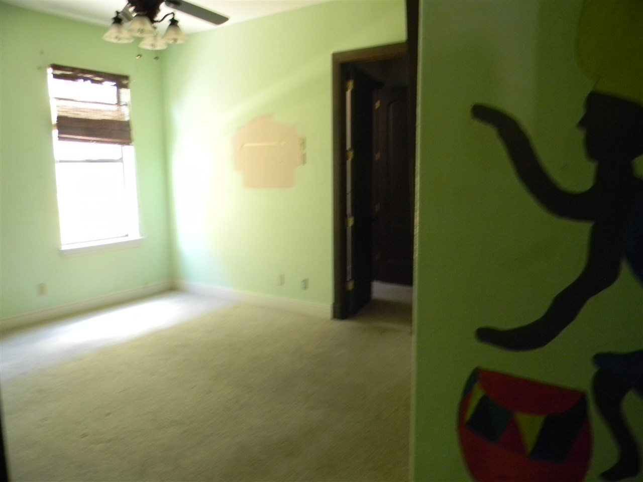 205 Lake Como Road Laredo, TX 78041 - Photo 3 of 20 a view of a room that has a bed and a window