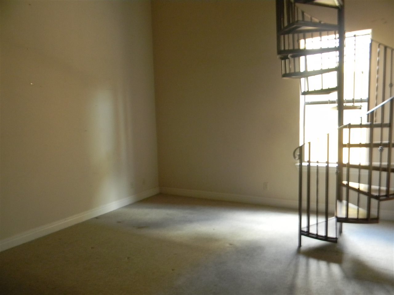 205 Lake Como Road Laredo, TX 78041 - Photo 7 of 20 an empty room with wooden floor and windows