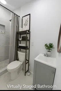 a view of a house with backyard and tree