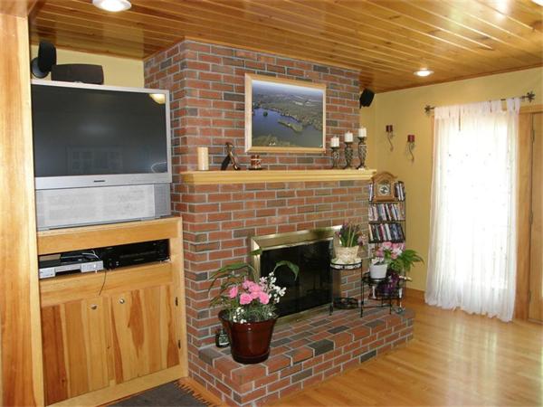 111 Pierpont Road Dudley, MA 01571 - Photo 15 of 30 a living room with furniture and a fireplace