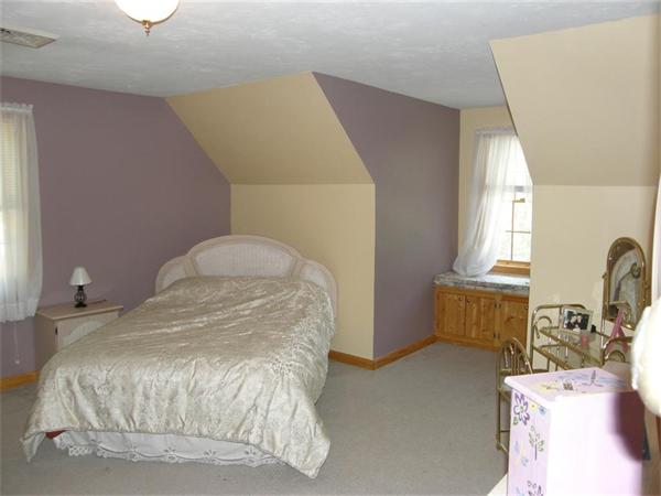 111 Pierpont Road Dudley, MA 01571 - Photo 24 of 30 a bedroom with a bed and wooden floor