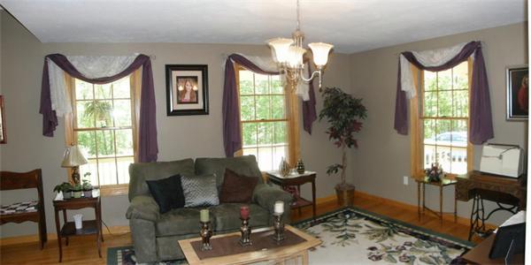 111 Pierpont Road Dudley, MA 01571 - Photo 9 of 30 a living room with furniture chandelier and a large window