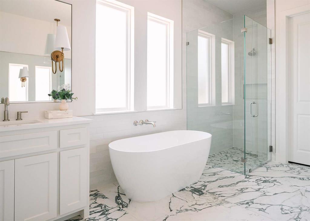 405 Kestrel Court Aledo, TX 76008 - Photo 12 of 31 a bathroom with a bathtub and shower