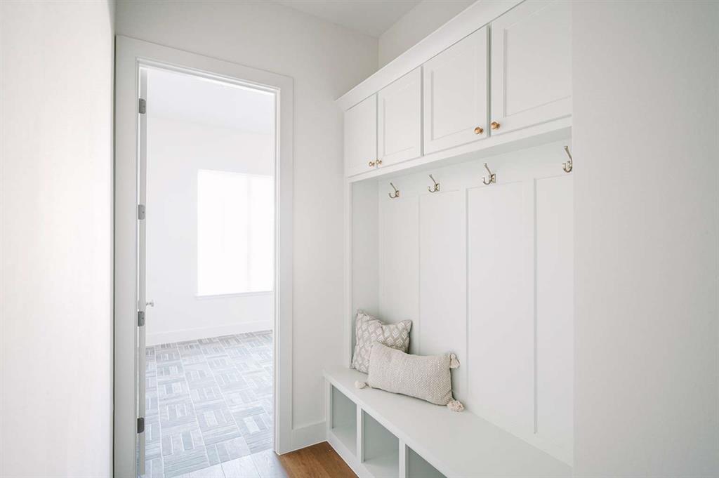 405 Kestrel Court Aledo, TX 76008 - Photo 15 of 31 a room with a white cabinets and a wooden floor