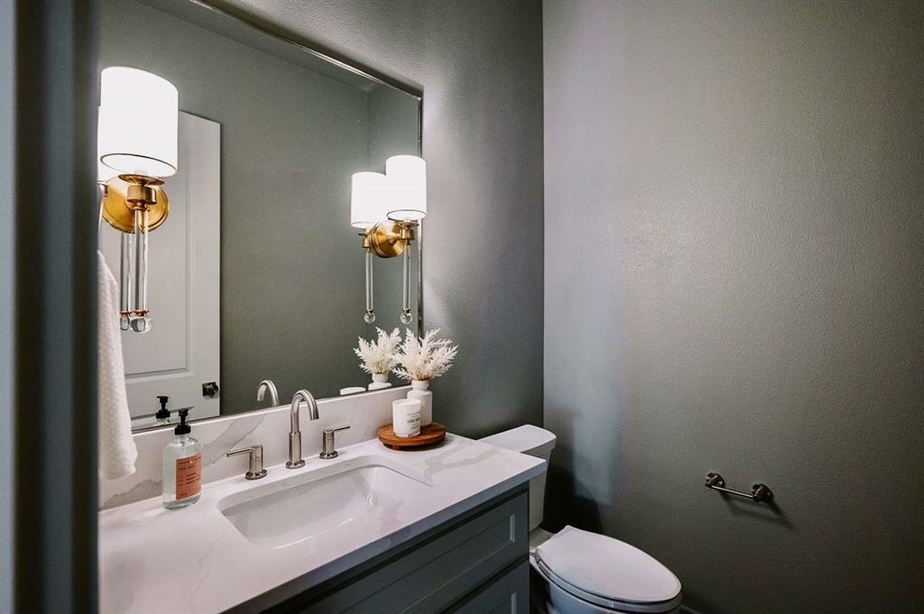 405 Kestrel Court Aledo, TX 76008 - Photo 18 of 31 a bathroom with a sink and a toilet