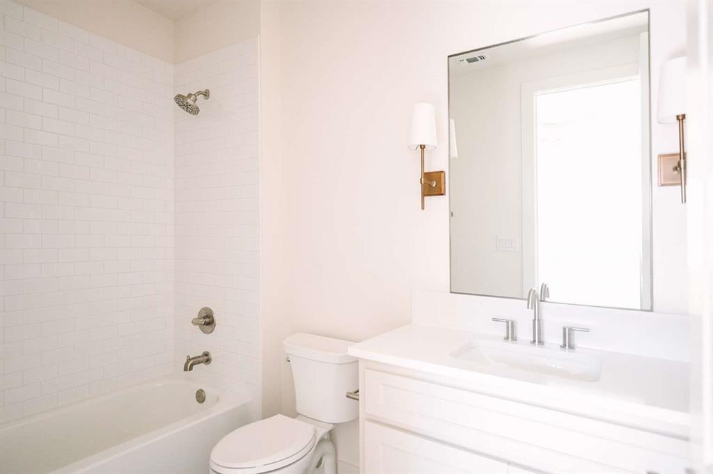 405 Kestrel Court Aledo, TX 76008 - Photo 27 of 31 a bathroom with a sink toilet and shower